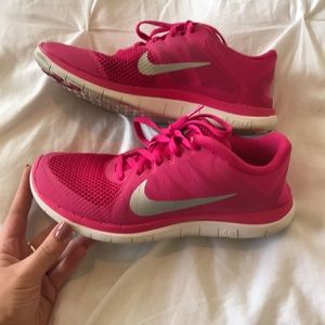 Women’s pink Nike Free 4.0 running shoes
